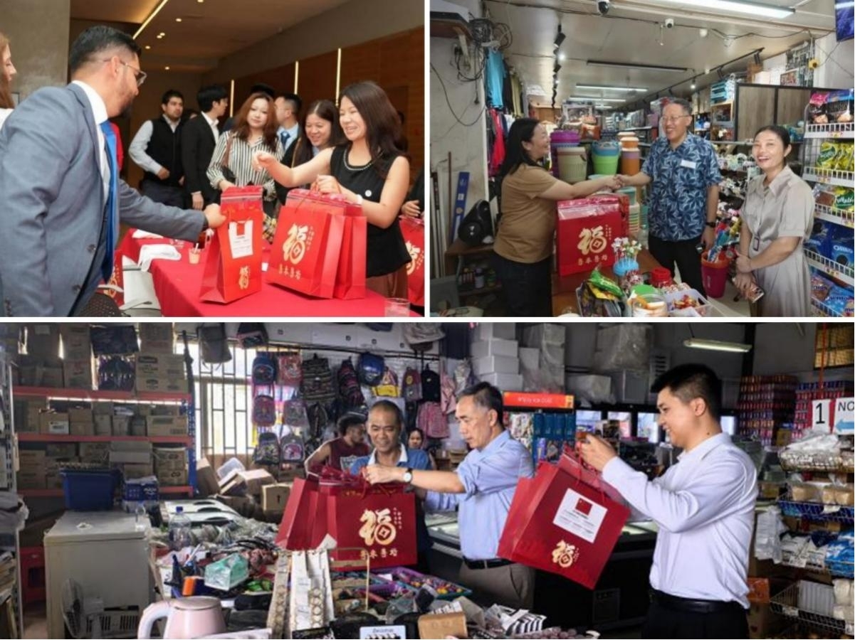 图为萨尔瓦多、瑙鲁、汤加侨胞收到广东省的暖心包